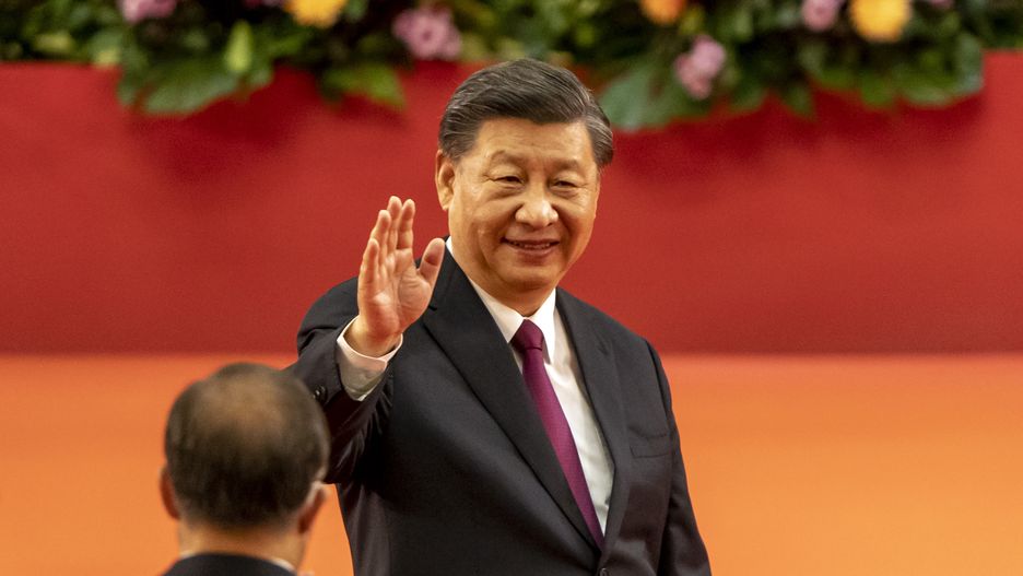 Xi Jinping, China's president, waves after speaking at a swearing-in ceremony for Hong Kong's chief executive John Lee in Hong Kong, China, on Friday, July 1, 2022. Hong Kongs new security-minded leader was sworn in by President Xi Jinping as the city marks 25 years of Chinese rule, after declaring the Asian financial hub had been reborn after a crackdown on the pro-democracy opposition. Photographer: Justin Chin/Bloomberg via Getty Images