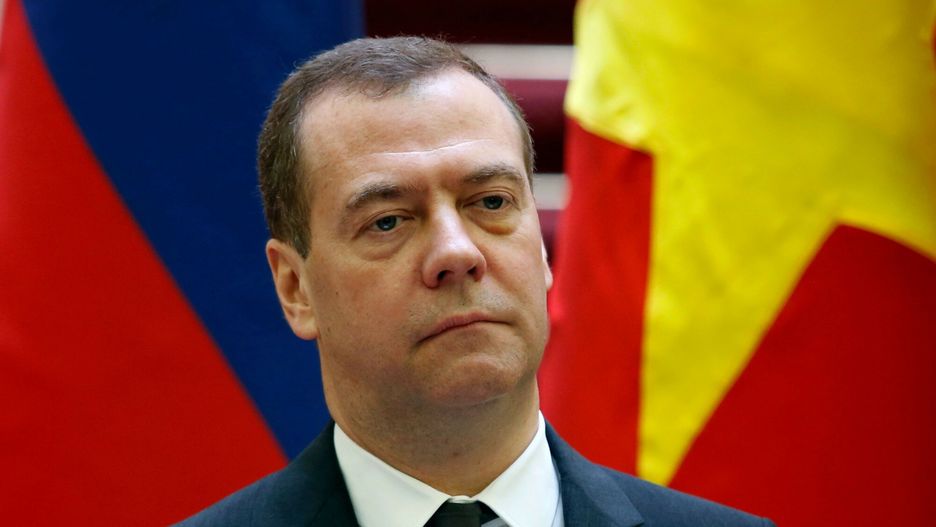 Temporary
Russia's Prime Minister Dmitry Medvedev listens during a joint press conference with his Vietnamese counterpart Nguyen Xuan Phuc at the Government Office in Hanoi on November 19, 2018. (Photo by KHAM / POOL / AFP)
KHAM