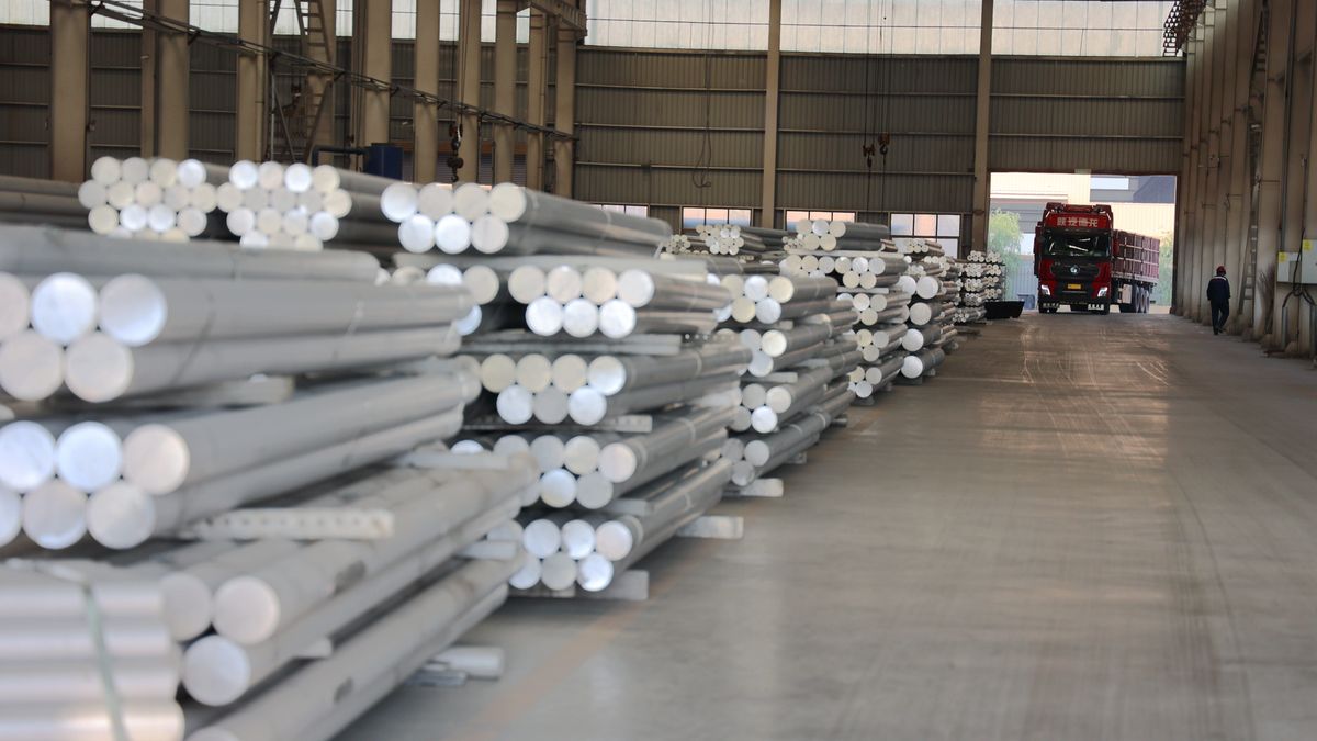 BINZHOU, CHINA - MAY 13: A worker prepares to load aluminum alloy rods onto a truck at the workshop of an aluminum product manufacturing enterprise on May 13, 2025 in Binzhou, Shandong Province of China. (Photo by Chu Baorui/VCG via Getty Images)