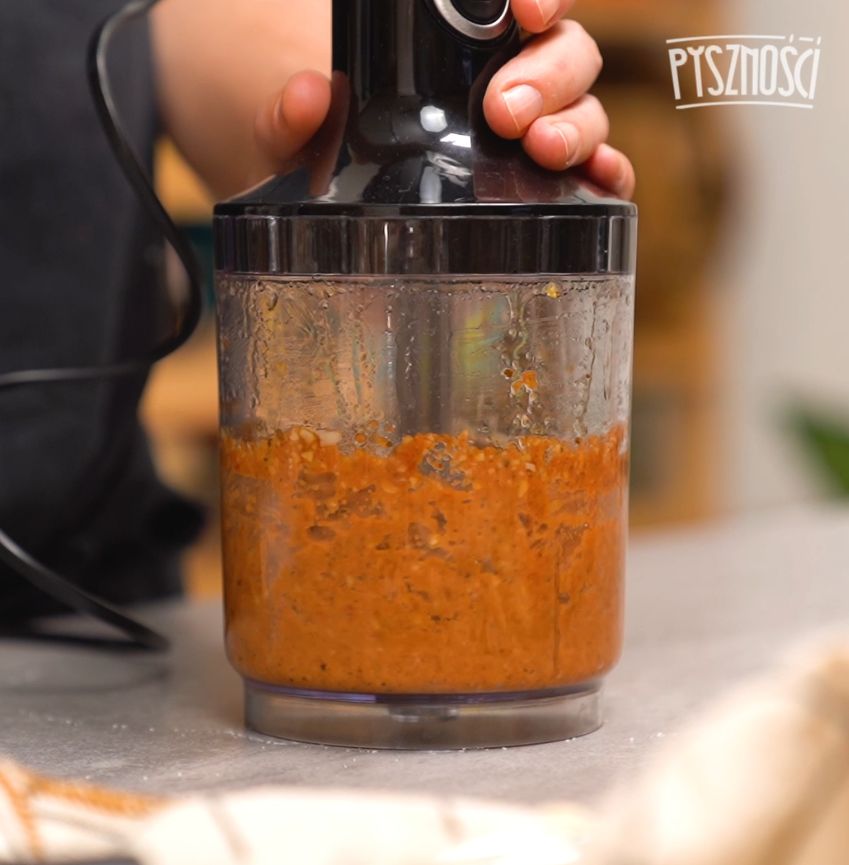 Homemade red tomato pesto can be eaten with spoons.