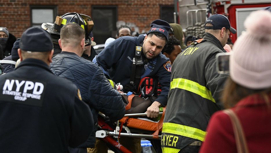 TemporaryEmergency personnel bring a fire victim to an ambulance during a high rise fire on East 181 Street, Sunday, Jan. 9, 2022, in the Bronx borough of New York. (AP Photo/Lloyd Mitchell)AP