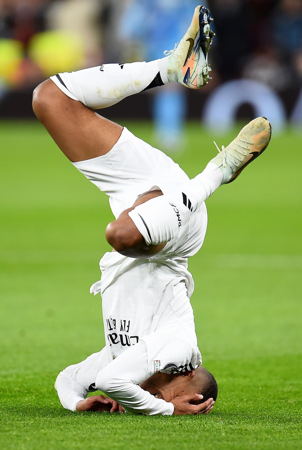 Kylian Mbappe after a collision with Virgil van Dijk