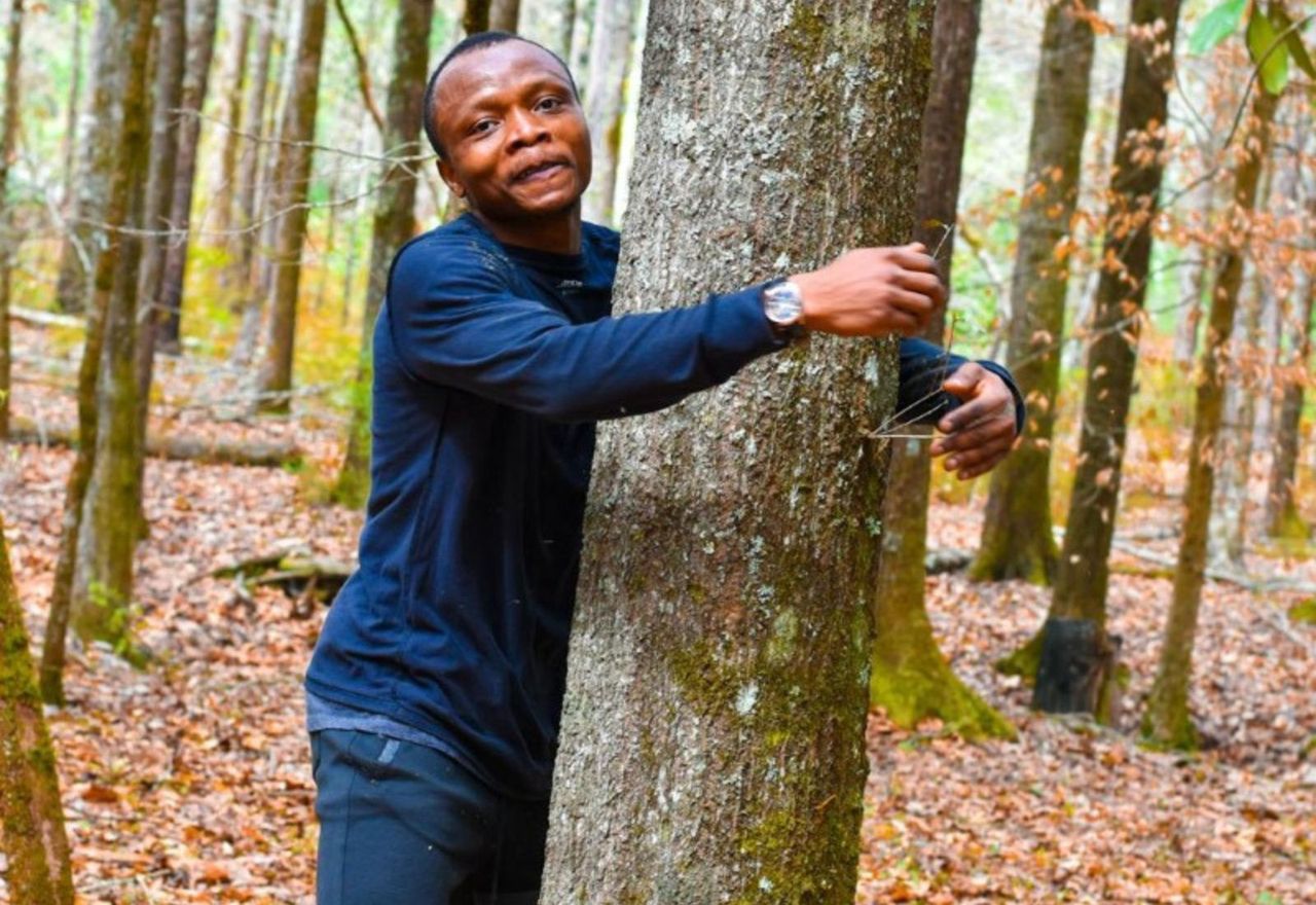 A student from Ghana set a world record in tree hugging.