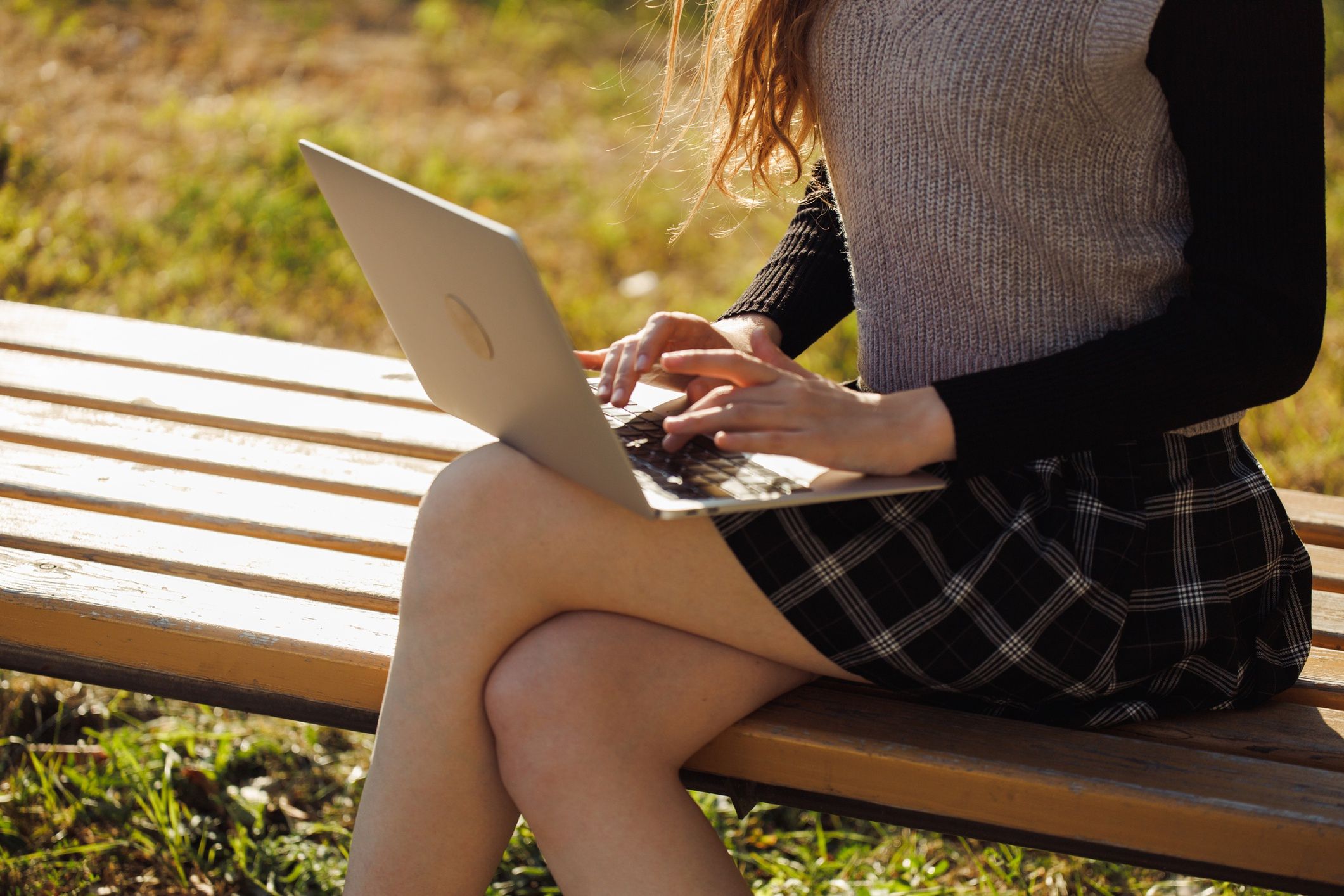 Cropped image of elegant well-dressed young woman sitting on sunlit bench typing on laptop
Cropped image of elegant well-dressed young woman sitting on sunlit bench typing on laptop, working on creative writing project, finding park serene atmosphere conducive to creative process
Iuliia Burmistrova