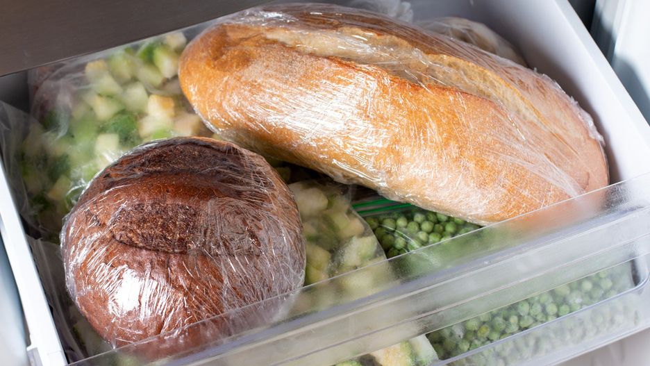 Frozen bread in the home freezer. Long life food storage concept.