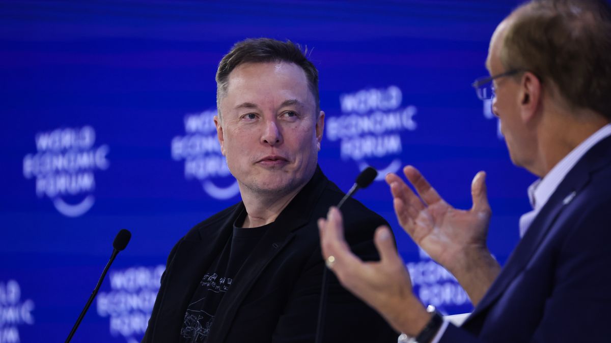 Elon Musk, chief executive officer of Tesla Inc., left, and Larry Fink, chief executive officer of BlackRock Inc., during the World Economic Forum (WEF) in Davos, Switzerland, on Thursday, Jan. 22, 2026. The annual Davos gathering of political leaders, top executives and celebrities runs from Jan. 19-23. Photographer: Krisztian Bocsi/Bloomberg via Getty Images