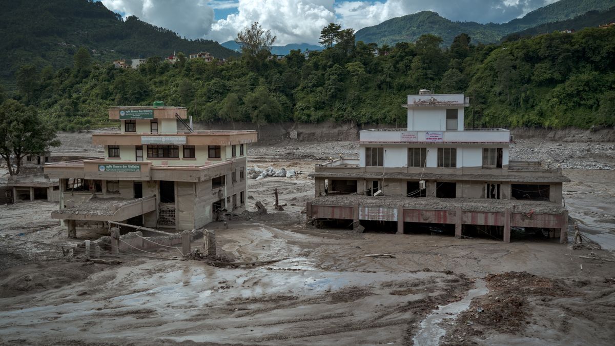 TRISHULI, NEPAL - AUGUST 27: Damaged buildings are seen partially covered in heavy mud following flash floods on August 27, 2026 in Trishuli, Nepal. A sudden flood swept through the Bhote Koshi River basin in northern Rasuwa on August 26, damaging settlements, roads and energy infrastructure as rescue teams searched for residents and foreign travellers reported out of contact. Hundreds were reported missing, as the death toll started to climb. (Photo by Ezra Acayan/Getty Images)