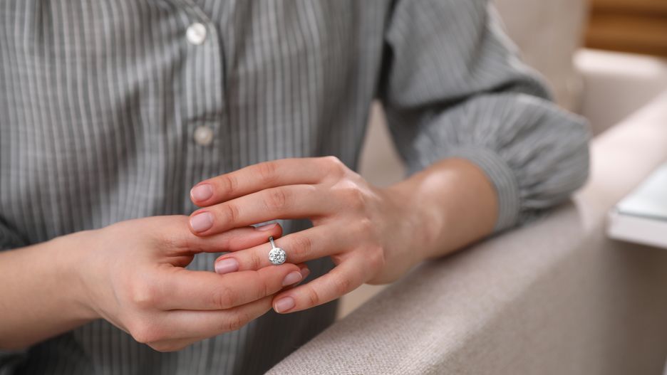 Woman taking off wedding ring indoors, closeup. Divorce conceptOlga Yastremska, New Africa, Afrproblems, closeup, background, adult, break, indoors, person, concept, family, wedding, taking, relationship, up, problem, sad, take, ring, leave, end, crisis, conflict, decision, removing, marriage, cheating, breakup, divorce, separation, betrayal, cheater, bereavement, spouse, drama, adultery, unfaithful, divorcing, divorcement, status, woman, female, wife, hand, finger, relation, split, engagement