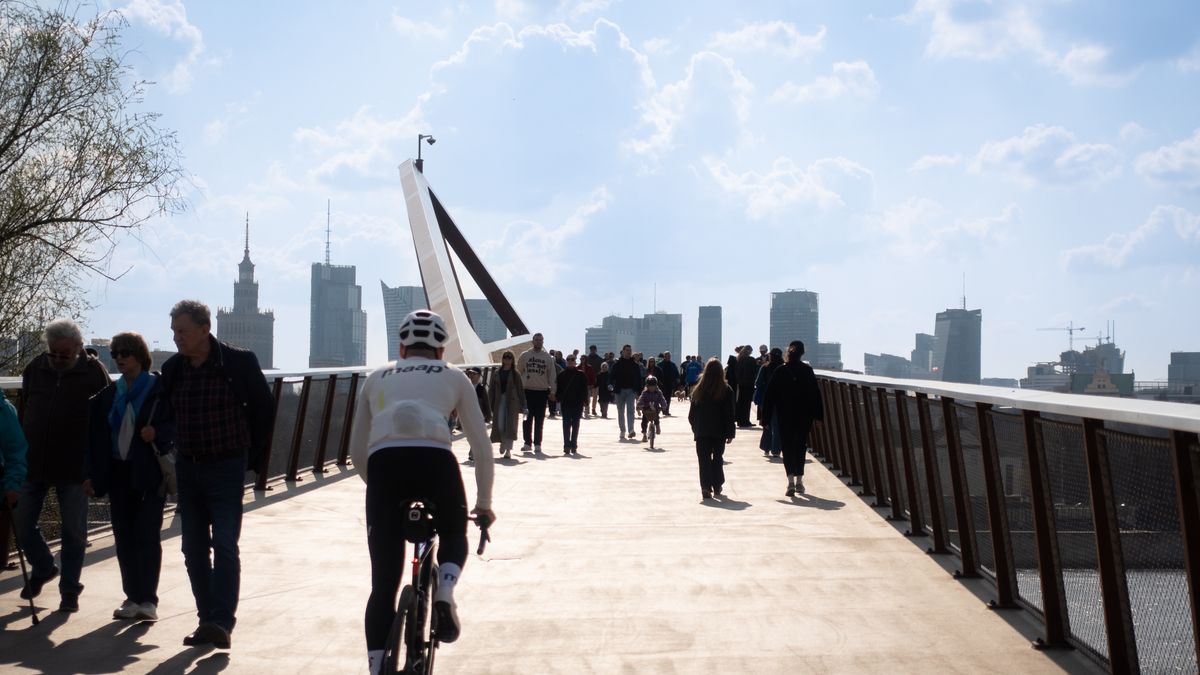 Crowds walk and cycle on the pedestrian and bicycle bridge over the Vistula River in Warsaw, Poland, on March 29, 2026. (Photo by Mateusz Wlodarczyk/NurPhoto via Getty Images)