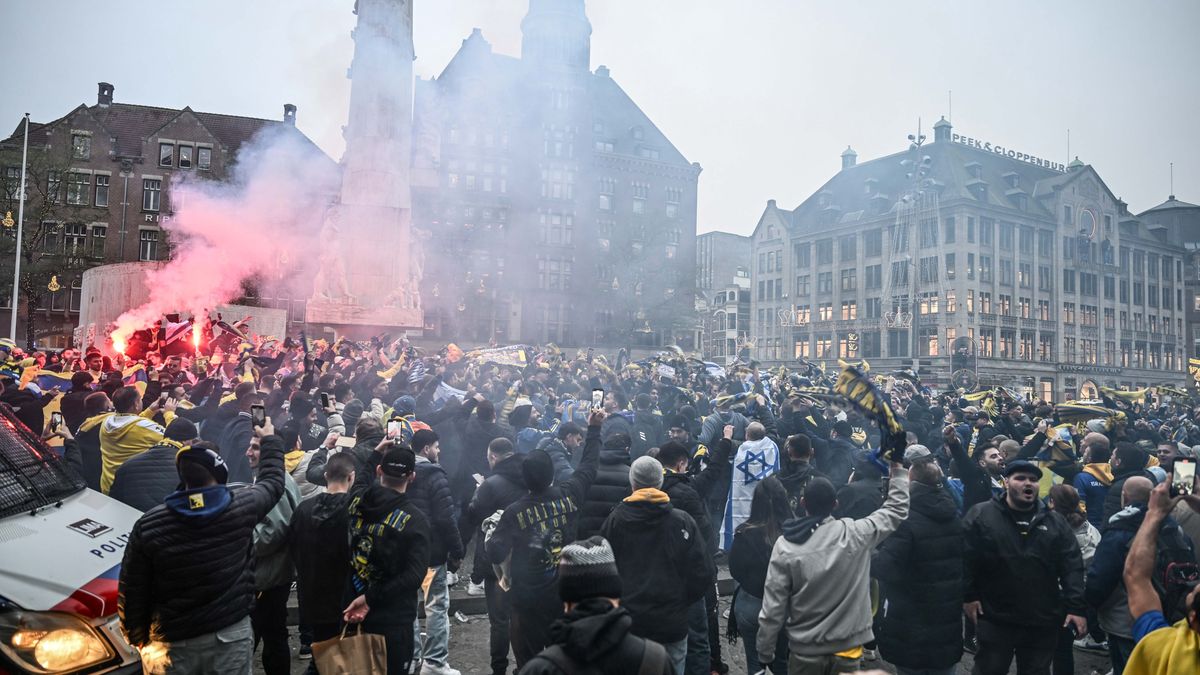 AMSTERDAM, NETHERLANDS - NOVEMBER 7: Fans of Maccabi Tel Aviv stage a pro-Israel demonstration at the Dam Square, lighting up flares and chanting slogans ahead of the UEFA Europa League match between Maccabi Tel Aviv and Ajax in Amsterdam, Netherlands on November 07, 2024. Maccabi fans clashed with pro-Palestinian citizens and ripped off Palestinian flags hung on the streets. In the lead-up to the Ajax vs Maccabi Tel Aviv match, several areas of Amsterdam have been designated as security risk zones. (Photo by Mouneb Taim/Anadolu via Getty Images)