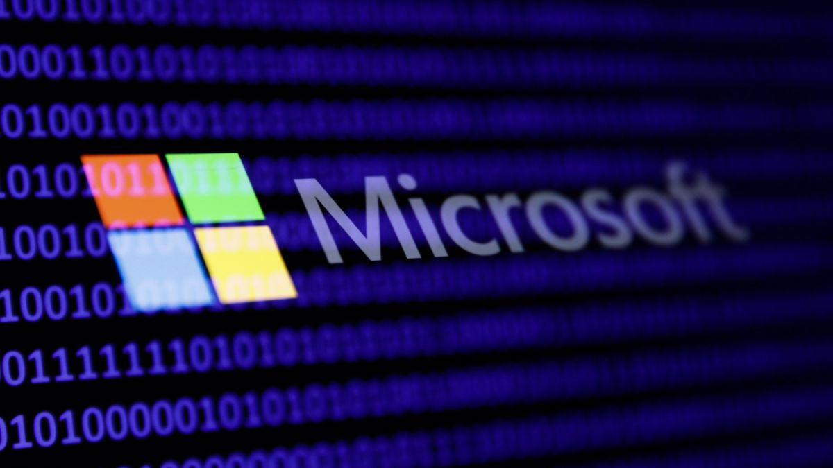 A binary code and Microsoft logo are seen in this multpiple exposure illustration photo taken in Krakow, Poland on February 21, 2024. (Photo by Jakub Porzycki/NurPhoto via Getty Images)