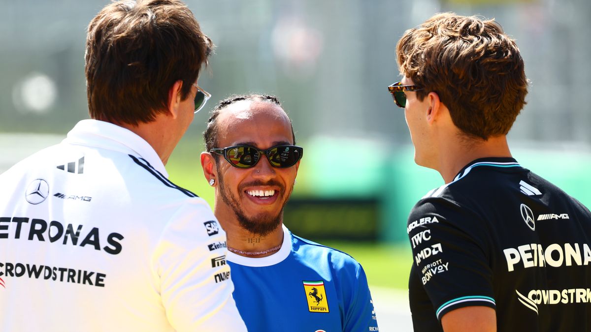 MONZA, ITALY - SEPTEMBER 07: Toto Wolff, Executive Director of Mercedes AMG Petronas F1 Team Lewis Hamilton of Great Britain and Scuderia Ferrari and George Russell of Great Britain and Mercedes AMG Petronas F1 Team talk on the drivers parade prior to the F1 Grand Prix of Italy at Autodromo Nazionale Monza on September 07, 2025 in Monza, Italy. (Photo by Joe Portlock/Getty Images)