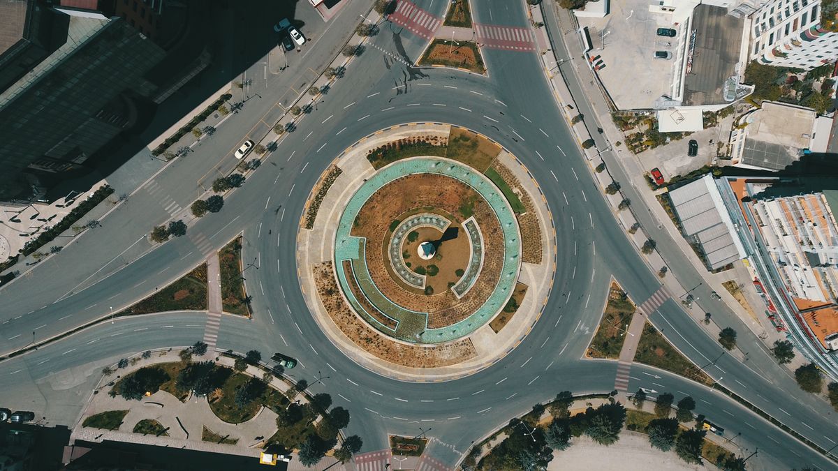TIRANA, ALBANIA - APRIL 19: An aerial view of roads to a roundabout remaining nearly empty due to the curfew imposed as a measure against the coronavirus (COVID-19) pandemic in Tirana, Albania on April 19, 2020. (Photo by Olsi Shehu/Anadolu Agency via Getty Images)