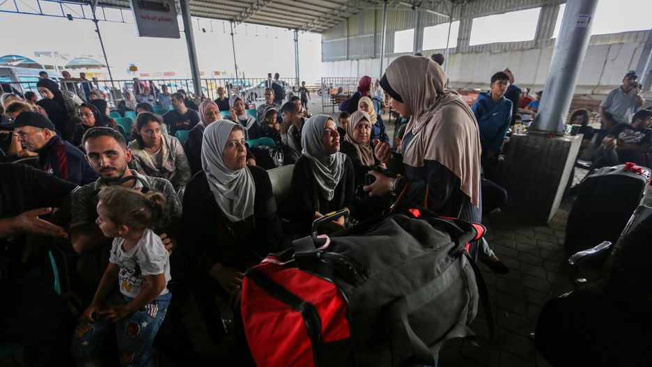 RAFAH, GAZA - NOVEMBER 2: Citizens with foreign passports wait to travel through the Rafah crossing on November 2, 2023 in Rafah, Gaza. For the first time since the outbreak of war between Israel and Hamas on October 7, the crossing here at the Gaza-Egyptian border opened this week to allow a small number of foreign passport holders and seriously wounded to enter Egypt. The wounded have been taken to nearby hospitals, while Egypt is also preparing a field hospital in the area. (Photo by Ahmad Hasaballah/Getty Images)