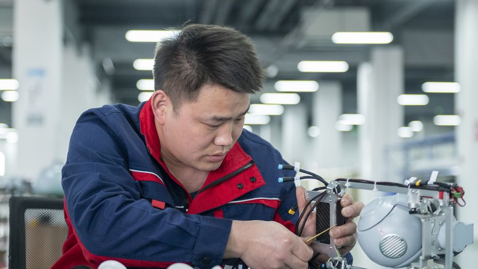CHENGDU, CHINA - MARCH 30: An engineer works on the assembly line of unmanned aerial vehicle (UAV) at Dapeng UAV manufacturing base production workshop on March 30, 2023 in Chengdu, Sichuan Province of China. (Photo by Liu Zhongjun/China News Service/VCG via Getty Images)