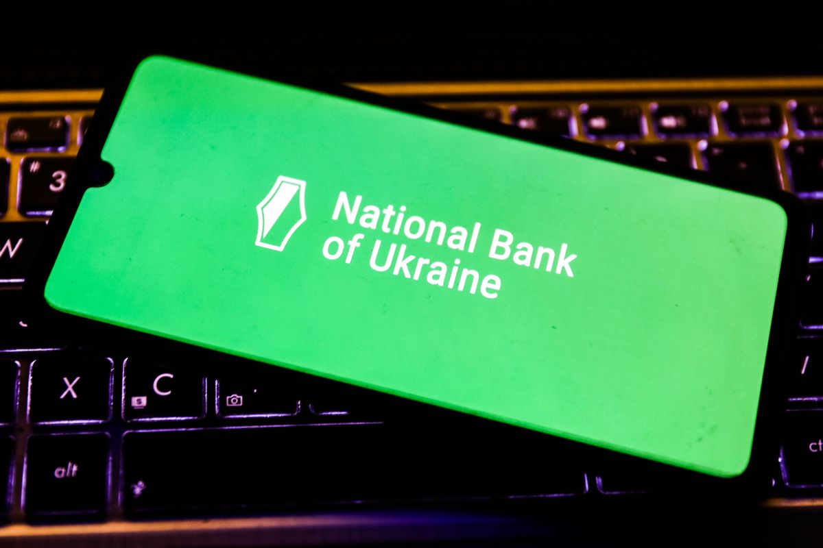 National Bank of Ukraine logo is displayed on a mobile phone screen photographed for the illustration photo taken in Krakow, Poland on February 15, 2022. The Ukrainian government has accused Russia of being behind Friday's cyber-attack on dozens of official websites. (Photo by Beata Zawrzel/NurPhoto via Getty Images)