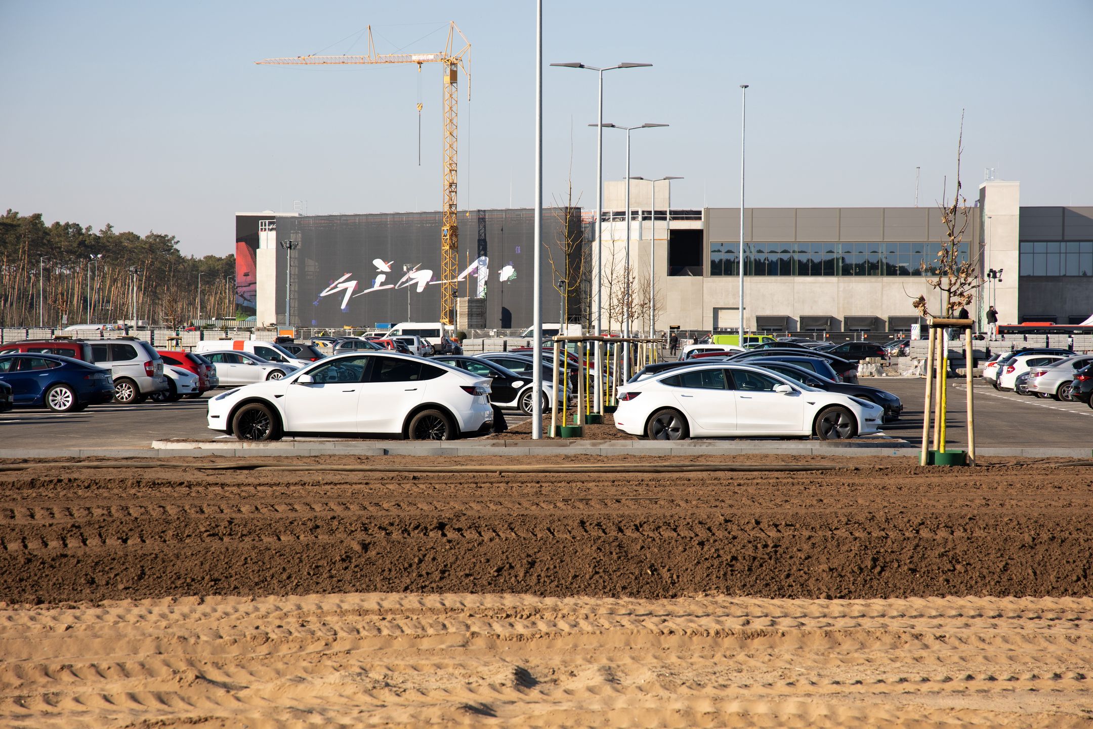 Tesla Inc. vehicles outside the automaker's Gigafactory on its opening day in Gruenheide, Germany, on Tuesday, March 22, 2022. The leading electric-vehicle maker officially opens its assembly plant outside Berlin today, Tesla's first carmaking plant in Europe. Photographer: Liesa Johannssen-Koppitz/Bloomberg via Getty Images