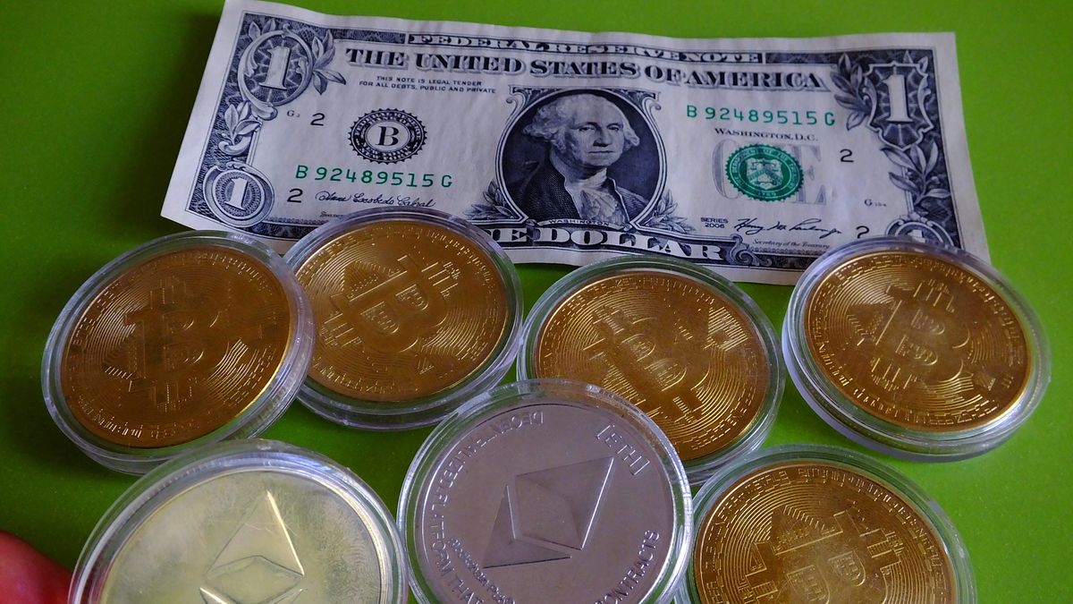 YICHANG, CHINA - JULY 23, 2021 - A list of bitcoin, Ether physical commemorative coins, US dollars, July 23, 2021, in Yichang, Hubei Province, China.
 (Photo credit should read Costfoto/Barcroft Media via Getty Images)