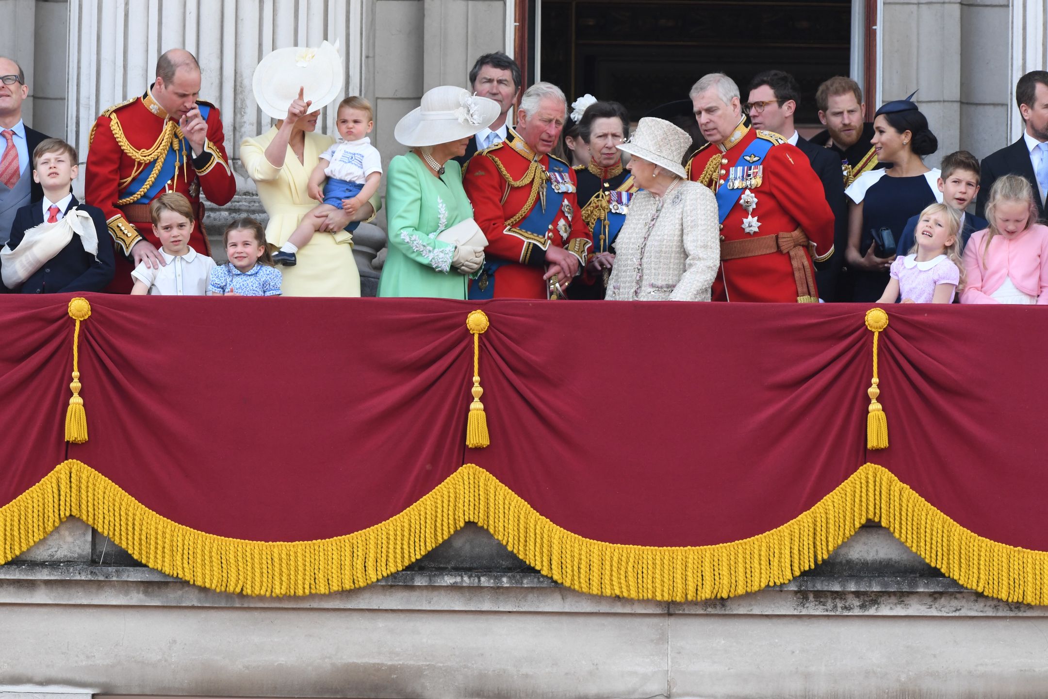 Trooping The Colour 2019LONDON,  UNITED KINGDOM - JUNE 08:  Prince William, Duke of Cambridge, Catherine, Duchess of Cambridge, Prince Louis of Cambridge, Prince George of Cambridge, Princess Charlotte of Cambridge, Camilla, Duchess of Cornwall, Prince Charles, Prince of Wales, Princess Anne, The Princess Royal, Queen Elizabeth ll, Prince Andrew, Duke of York, Prince Harry, Duke of Sussex and Meghan, Duchess of Sussex stand on the balcony of Buckingham Palace following Trooping the Colour on June 08, 2019 in London, England. (Photo by Anwar Hussein/WireImage)Anwar Husseinroyal