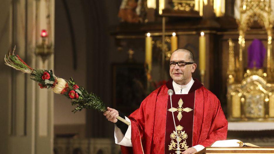 Priest Jacek Stryczek holds a traditional Easter palm during Holy Mass on Palm Sunday celebration. Krakow, Poland on April 5th, 2020. Due to the spread of coronavirus the Polish episcopate announced an exemption and invited the faithful to take part in Sunday mass via the internet, radio or television and religious services can have a maximum of five attendees. (Photo by Beata Zawrzel/NurPhoto via Getty Images)