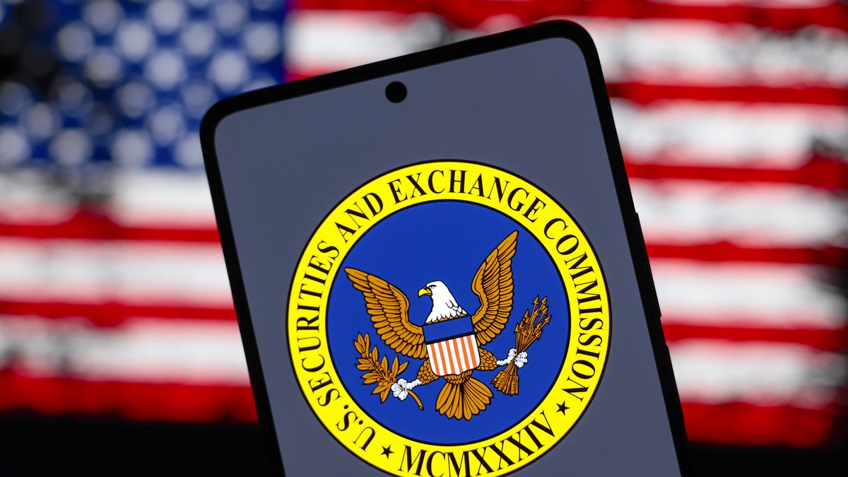 PARAGUAY - 2024/08/15: In this photo illustration, the United States Securities and Exchange Commission (SEC) logo is displayed on a smartphone screen and the flag of the United States of America (USA) in the background. (Photo Illustration by Jaque Silva/SOPA Images/LightRocket via Getty Images)