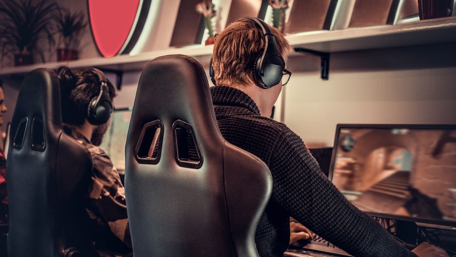 Team of teenage gamers plays in a multiplayer video game on pc in a gaming club.A team of teenage gamers plays in a multiplayer video game on pc in a gaming club.Vladimirs Poplavskischampionship, party, multiracial, interracial, friends, toned, internet, online, player, technology, gamer, computer, young, game, play, club, monitor, headphones, electronic, virtual, fun, indoors, enjoy, leisure, lifestyle, pc, multiplayer, hobby, teenager, equipment, gaming, cyber, stream, tournament, esports, headset, competitive, modern, competition, together, cybersport, e-sport, team, concentrated, media, focused, match, challenge, professional, battle, dark, internet cafe