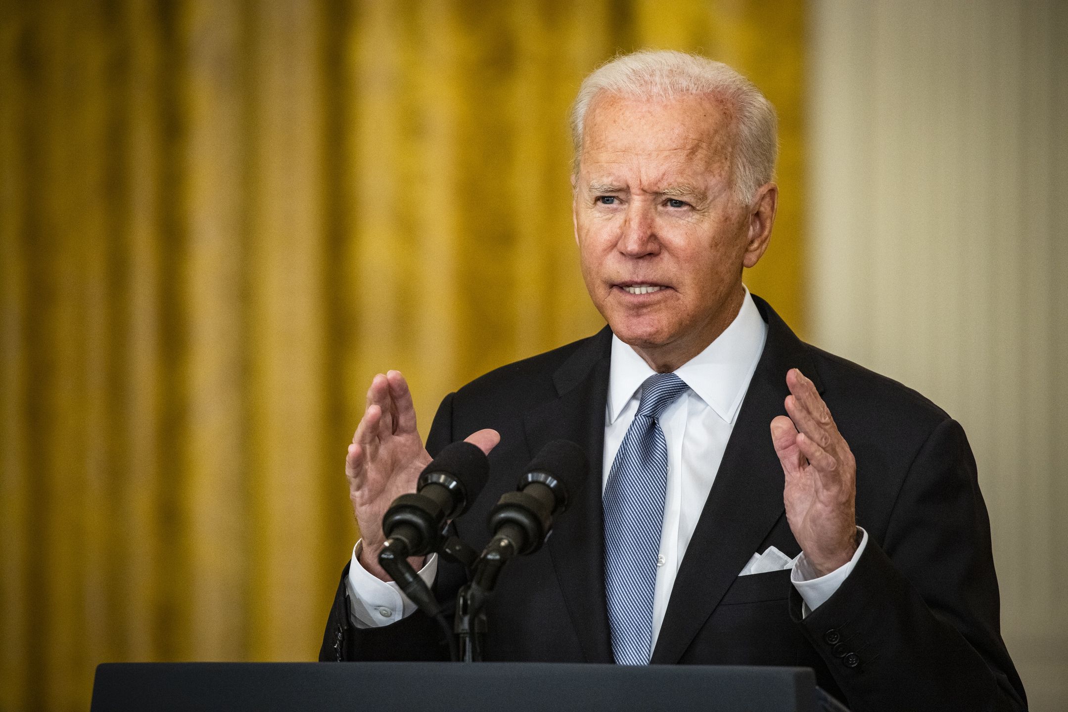 U.S. President Joe Biden speaks in the East Room of the White House in Washington, D.C., U.S., on Monday, Aug. 16, 2021. President Biden defended his decision to withdraw U.S. troops from Afghanistan on Monday, fighting back against criticism of a move that pitched the country into chaos as the Taliban reasserted control. Photographer: Samuel Corum/Bloomberg via Getty Images