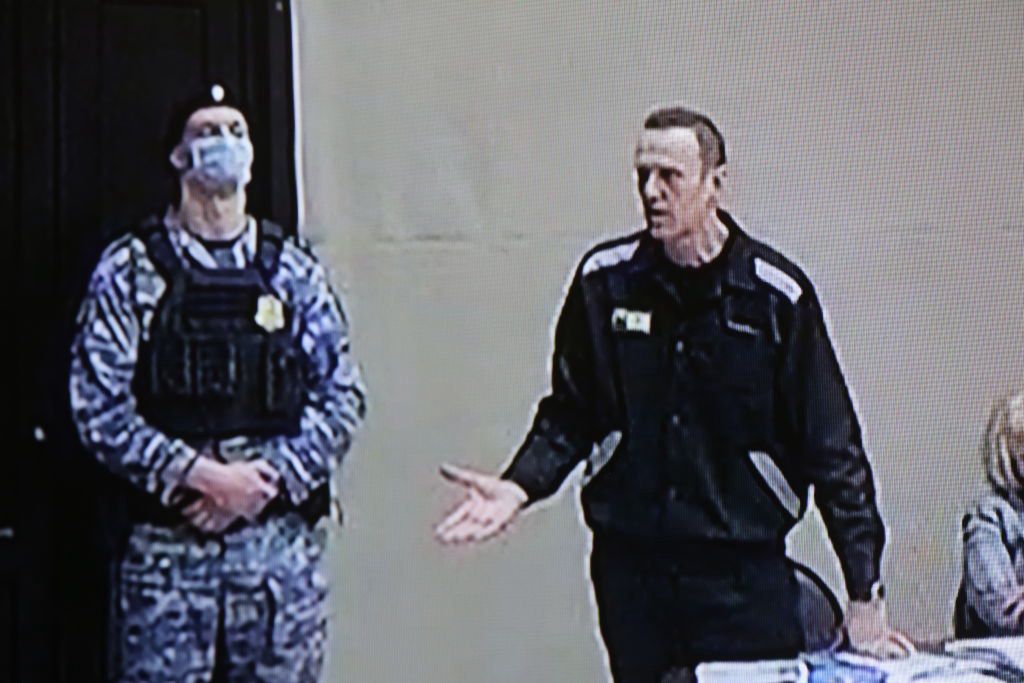 Trial Of Alexei NavalnyPOKROV, RUSSIA - FEBRUARY,21 (RUSSIA OUT): Russian opposition politician Alexei Navalny seen speaking on the screen during the trial at the Penal Colony Number 2, Ferburary,21,2022, in Pokrov, Vladimir region, Russia. A new trial against Russian opposition leader and Kremlin critic Alexei Navalny started last week. (Photo by Mikhail Svetlov/Getty Images)Mikhail Svetlov