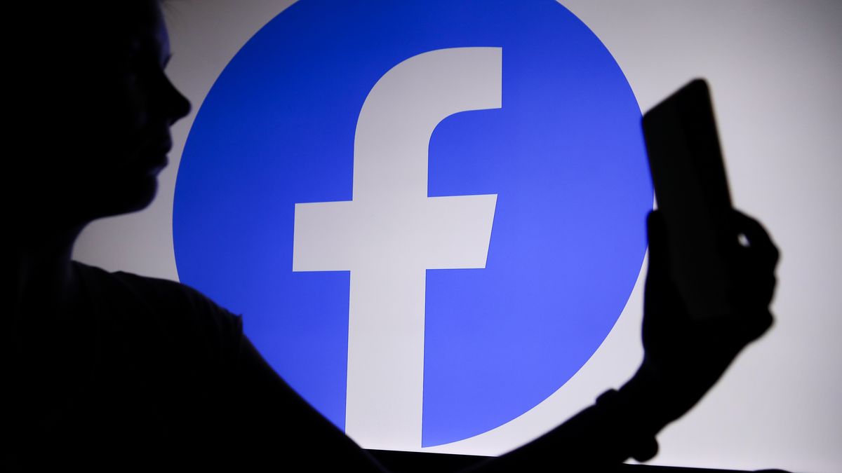 The Facebook logo with a person holding a phone in his hand is seen in Knurow, Poland, on April 20, 2025. (Photo Illustration by Klaudia Radecka/NurPhoto via Getty Images)