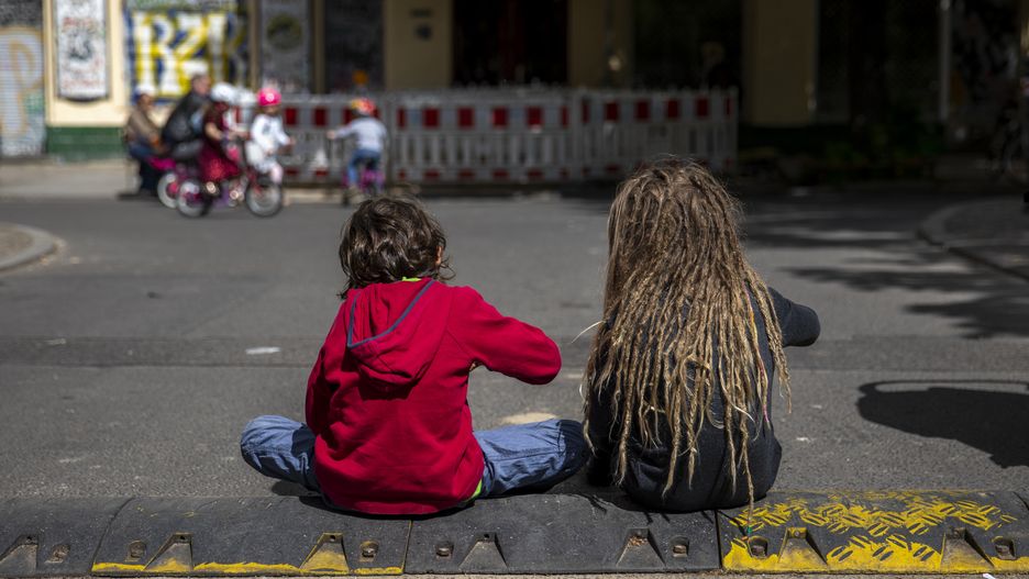 BERLIN, GERMANY - MAY 17: Children sit in a middle of the street that is closed for cars on Sundays for kids to play on May 17, 2020 in Kreuzberg in Berlin, Germany. As authorities continue to ease lockdown restrictions nationwide businesses are reopening, tourism is becoming possible again and more children are returning to school. At the same time health experts are monitoring infection rates carefully for signs of any resurgence. (Photo by Maja Hitij/Getty Images)