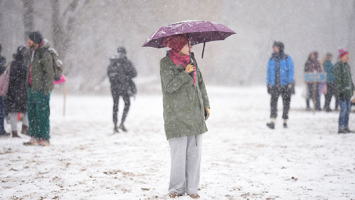 Warsaw Daily Life
A woman holding an umbrella is seen during snowfall on a beach on the right bank of the Vistula river in Warsaw, Poland on 23 November, 2025. (Photo by Jaap Arriens/NurPhoto via Getty Images)
NurPhoto
extreme conditions, community spirit, poland election, local customs, health enthusiasts, group activity, cold exposure, cold-weather ritual, cold plunge, determined swimmers, cold-weather activity, climate conditions, warsaw backdrop, crisp morning, cold air, cold water therapy, poland elections, group endurance, endurance event, health movement, community gathering, documentary image, city skyline, community event, icy water, cold water challenge, cheering crowd, endurance swimmers, extreme swimming, chilly temperature, invigorating swim, elections, annual gathering, daily life, cold, immersion, event participants, fitness culture, cold water swimming, warsaw culture, early winter, cold environment, editorial photography, foggy atmosphere