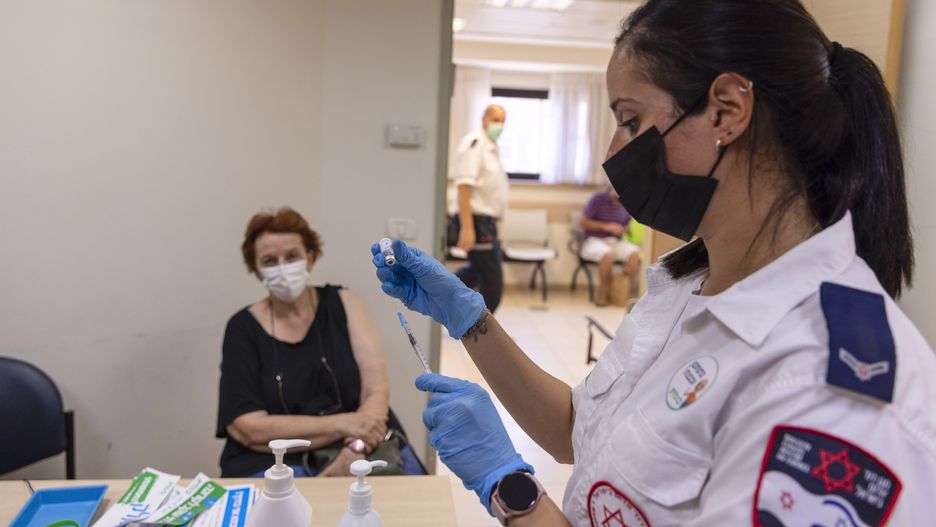 An elderly resident waits to receive a third dose of the Pfizer-BioNTech Covid-19 vaccine at the Clalit Health Services clinic in Tel Aviv, Israel, on Monday, Aug. 2, 2021. Israel is now giving seniors a booster dose of vaccine to help control the recent uptick in cases. Photographer: Kobi Wolf/Bloomberg via Getty Images