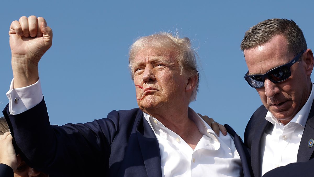 Donald Trump Injured During Shooting At Campaign Rally In Butler, PA
BUTLER, PENNSYLVANIA - JULY 13: Republican presidential candidate former President Donald Trump pumps his fist as he is rushed offstage by U.S. Secret Service agents after being grazed by a bullet during a rally on July 13, 2024 in Butler, Pennsylvania. Butler County district attorney Richard Goldinger said the shooter is dead after injuring former U.S. President Donald Trump, killing one audience member and injuring another in the shooting. (Photo by Anna Moneymaker/Getty Images)
Anna Moneymaker