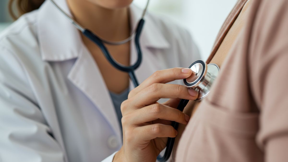 A physician uses a stethoscope to examine a patient's heart during a clinic appointment.A doctor listens to a patient's heartbeat with a stethoscope during a medical exam, showcasing healthcare and well-being. AI generated.doctor, stethoscope, patient, healthcare, medical, examination, checkup, heart, medicine, clinical, nurse, health, diagnosis, wellness, cardiology, physician, treatment, medical professional, cardiac, clinic, hospital, medical equipment, healthcare provider, preventive medicine, auscultation, internal medicine, well-being, listening, body, professional, specialist, care, medical care, uniform, white coat, female doctor, woman doctor, medical examination, disease, prevention, medical tool, diagnostics, healthcare system, medical clinic, stethoscope exam, cardiovascular health, general practitioner, family medicine, medical technology, doctor, stethoscope, patient, healthcare, medical, examination, checkup, heart, medicine, clinical, nurse, health, diagnosis, wellness, cardiology, physician, treatment, medical professional, cardiac, clinic, hospital, medical equipment, healthcare provider, preventive medicine, auscultation, internal medicine, well-being, listening, body, professional, specialist, care, medical care, uniform, white coat, female doctor, woman doctor, medical examination, disease, prevention, medical tool, diagnostics, healthcare system, medical clinic, stethoscope exam, cardiovascular health, general practitioner, family medicine, medical technology