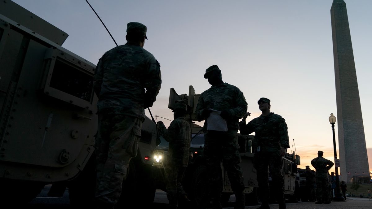 Members of the National Guard and armored vehicles near the Washington Monument in Washington, DC, US, on Tuesday, Aug. 12, 2025. US President Donald Trump announced he would take control of Washington's DC's Metropolitan Police Department and deploy the National Guard as part of a push to reduce crime and homelessness in the nation's capital. Photographer: Stefani Reynolds/Bloomberg via Getty Images