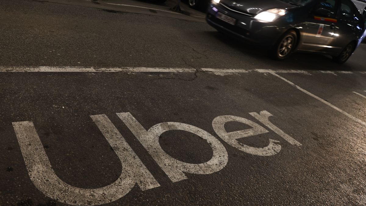 Uber logo is seen at pick-up spot in Warsaw, Poland on February 24, 2024. (Photo by Jakub Porzycki/NurPhoto via Getty Images)