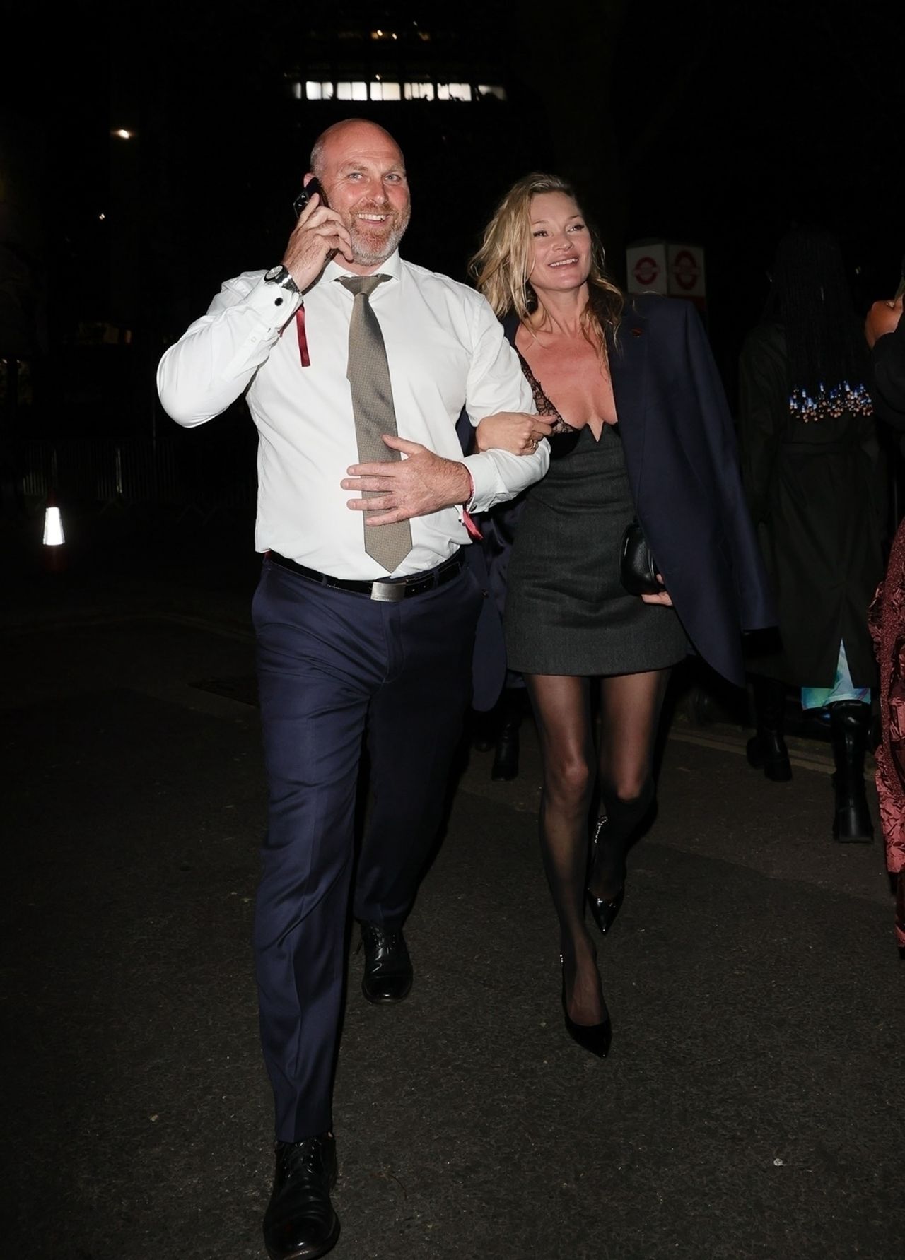 Laughing Kate Moss runs out of the Gucci after party.