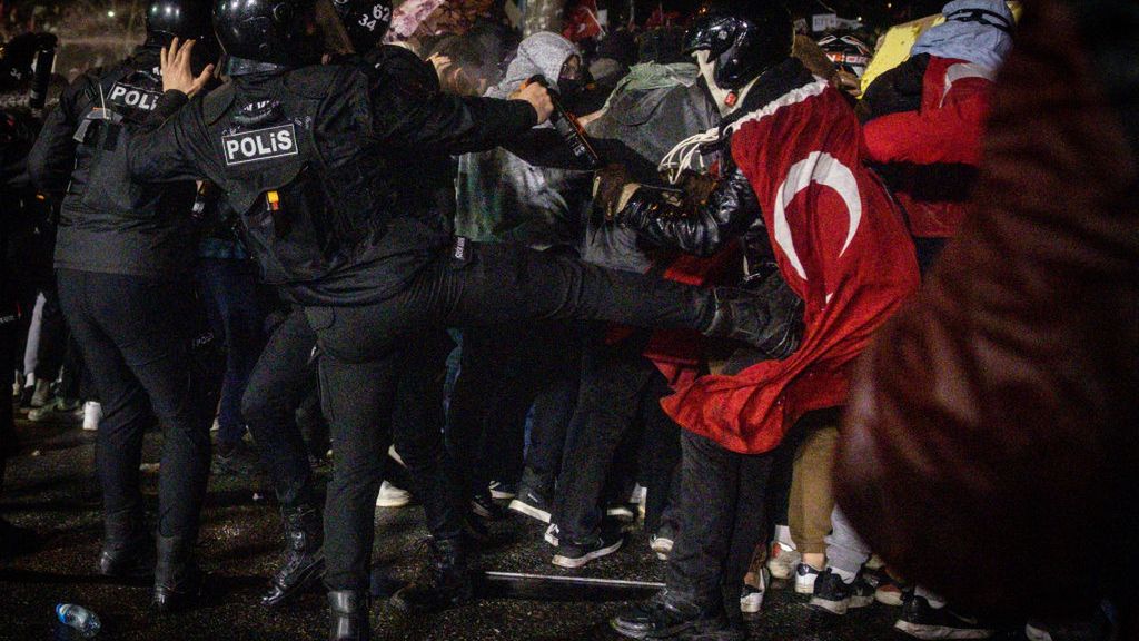 Istanbul Mayor Ekrem Imamoglu Charged With Corruption Amid Wave Of Protests
ISTANBUL, TURKEY - MARCH 23: A police officer kicks a protester during clashes in front of Istanbul's famous Aquaduct on March 23, 2025 in Istanbul, Turkey. The Mayor of Istanbul Ekrem Imamoglu, who was due to be selected as a presidential candidate for the opposition Republican People's Party (CHP) during a primary election today, was jailed on corruption charges following his detention earlier this week. He was among at least 100 politicians, business leaders and journalists detained as part of investigations into corruption and support for terrorism, according to Turkish authorities. Critics called the arrests politically motivated. (Photo by Chris McGrath/Getty Images)
Chris McGrath