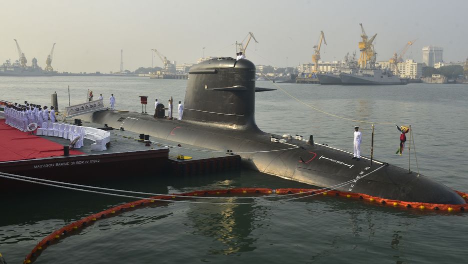 MUMBAI, INDIA - NOVEMBER 25: Indian Naval officers standing on the deck of INS Vela Submarine during its commissioning ceremony at Naval Dockyard, on November 25, 2021 in Mumbai, India. The Indian Navy has commissioned its fourth, stealth Scorpene-class submarine under Project 75, INS Vela on Thursday. Known as the 'Silent Killer', this induction will boost the Navy's combat capability. (Photo by Anshuman Poyrekar/Hindustan Times via Getty Images)