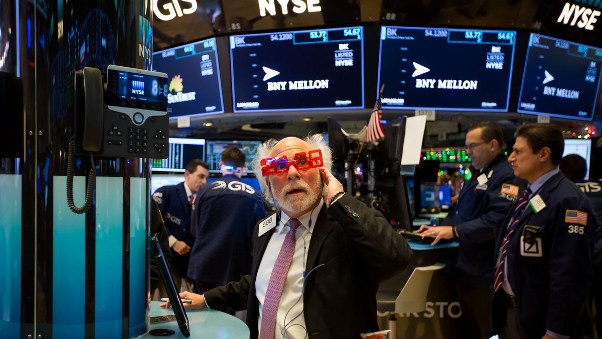 Last Day Of Trading For 2017 On The Floor Of The NYSEA trader wearing 2018 glasses works on the floor of the New York Stock Exchange (NYSE) in New York, U.S., on Friday, Dec. 29, 2017. U.S. stocks fluctuated in thin trading on the final market day of 2017, while the dollar's slump continued as the euro headed for its best annual performance in 14 years. Photographer: Michael Nagle/Bloomberg via Getty ImagesBloombergUSA, NYSE, Americas, U.S.A., Best Photo, Best Photos