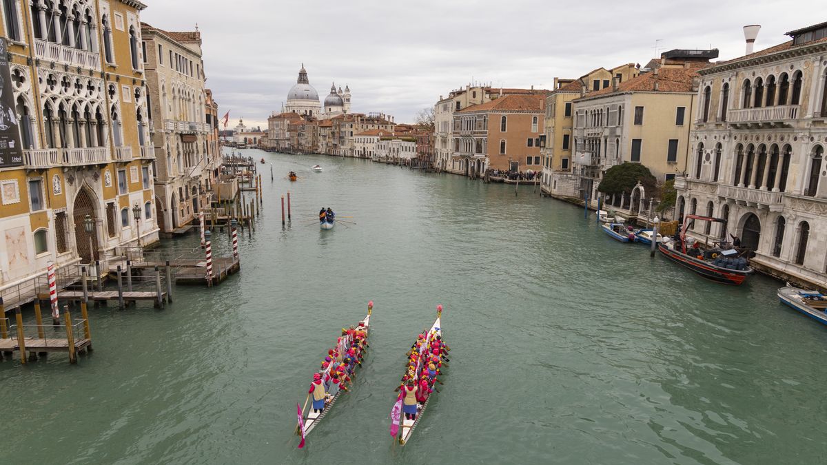 VENICE, ITALY - FEBRUARY 5: Rowers wearing costumes sail along Grand Canal during the Carnival Regatta for the opening of the 2023 Venice Carnival on February 5, 2023, in Venice, Italy. The theme for 2023 edition of Venice Carnival is âTake Your Time For Original Signsâ and it will run from February 4 to February 21. (Photo by Federico Vespignani/Anadolu Agency via Getty Images)