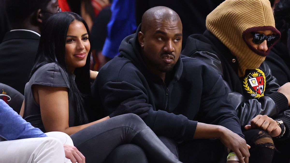 MIAMI, FLORIDA - MARCH 12: Rapper Kanye West and girlfriend Chaney Jones attend a game between the Miami Heat and the Minnesota Timberwolves at FTX Arena on March 12, 2022 in Miami, Florida. NOTE TO USER: User expressly acknowledges and agrees that, by downloading and or using this photograph, User is consenting to the terms and conditions of the Getty Images License Agreement. (Photo by Michael Reaves/Getty Images)
