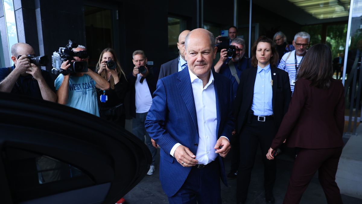Olaf Scholz, Germany's chancellor, center, departs following a pre-summer break news conference in Berlin, Germany, on Wednesday, July 24, 2024. "I will run to become chancellor again," Scholz told reporters on Wednesday, responding to a question of whether he might follow US President Joe Biden's lead and refrain from running for a new term. Photographer: Krisztian Bocsi/Bloomberg via Getty Images