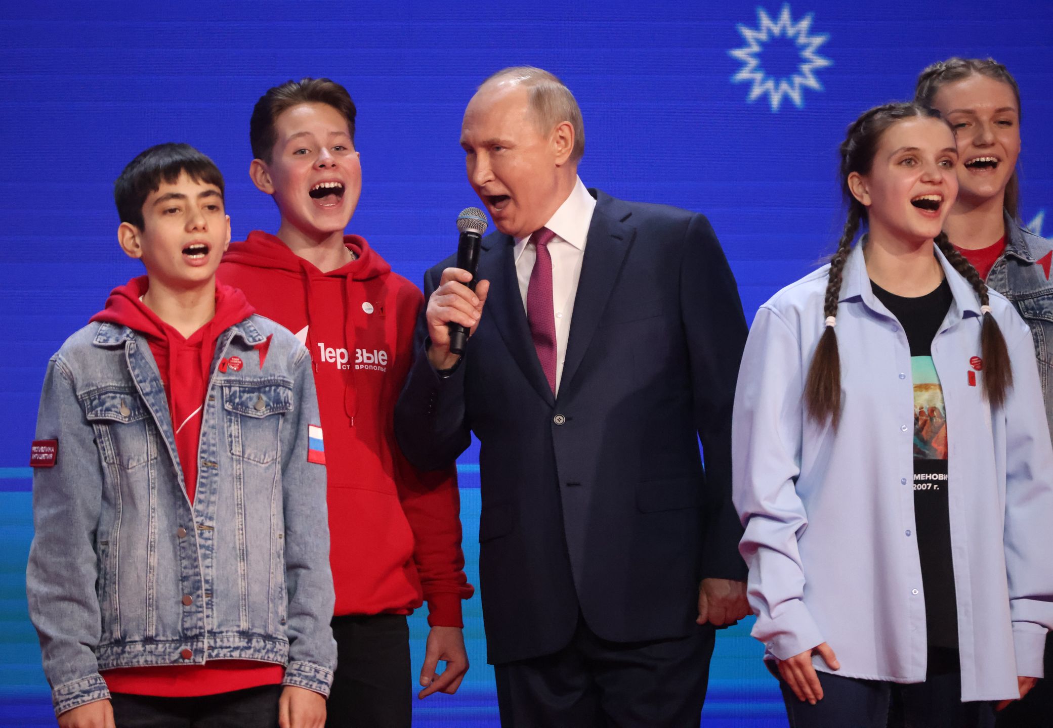 Russian President Vladimir Putin Attends Youth Congress Event By The Movements Of The FirstMOSCOW, RUSSIA - FEBRUARY 1: (RUSSIA OUT) Russian President Vladimir Putin (C) sings the national anthem during the 2nd Congress of the Movement of the First on February 1, 2024 in Moscow, Russia. President Putin visited the congress event , hosted by Kremlin-backed children's movement, created in 2022, inspired by traditions of Soveit-era Young Pioneer organisaton, existed in the USSR between 1922 and 1991. (Photo by Contributor/Getty Images)Contributorbestof, topix