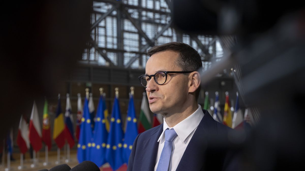 Mateusz Morawiecki Prime Minister of Poland arrives at the EU summit, walking next to the European flags, flag of Europe and talks to the media while is answering questions from journalists. During this meeting Ukraine and Moldova have both been accepted as EU candidate members status. Meeting of the EU leaders, the European Council and Eurosummit in Brussels, Belgium on June 24, 2022 (Photo by Nicolas Economou/NurPhoto via Getty Images)