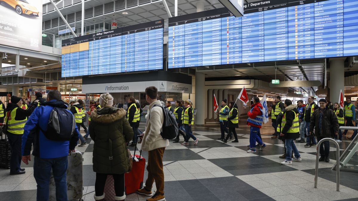 Ground services employees from the Verdi union protest march through the airport during strike action at Munich International Airport in Munich, Germany, on Friday, Feb. 17, 2023. Germany's two largest airports, Frankfurt and Munich, came to a virtual standstill today as ground staff stage another strike over pay, exacerbating an already chaotic week for air travel after a system outage brought down Deutsche Lufthansa AGs operations two days ago. Photographer: Michaela Rehle/Bloomberg via Getty Images