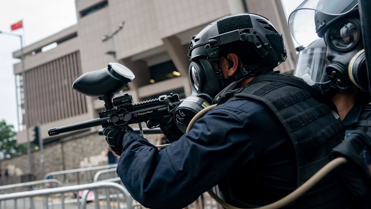 Hong Kongers Protest Over China Extradition LawHONG KONG, HONG KONG - JUNE 12:  A policer officer fires a pallet gun during a protest on June 12, 2019 in Hong Kong China. Over a million protesters marched in Hong Kong on Sunday against a controversial extradition bill that would allow suspected criminals to be sent to mainland China for trial as tensions escalated in recent weeks.(Photo by Anthony Kwan/Getty Images)Anthony Kwan