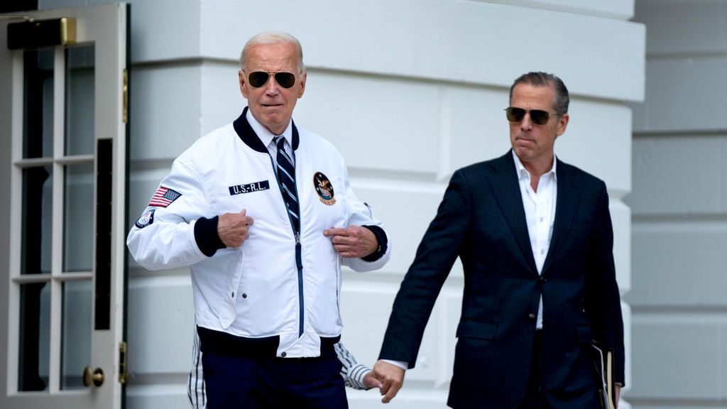 President Biden Departs White House For Camp David
Hunter Biden, son of US President Joe Biden, right, watches as US President Joe Biden gestures to his "Team USA" jacket on the South Lawn of the White House before boarding Marine One in Washington, DC, US, on Friday, July 26, 2024. Three Republican attorneys general on Friday urged the US Supreme Court not to interfere with a lower court order prohibiting the Biden administration from extending sex discrimination protections to LGBTQ+ students. Photographer: Bonnie Cash/UPI/Bloomberg via Getty Images
Bloomberg
north american, us, united states of america, the white house, americas, government news, u.s.a., american, 2024uspolitics, u.s. government