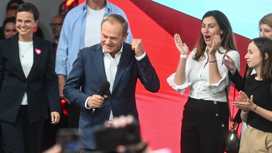 WARSAW, POLAND - OCTOBER 15: The leader of Civic Coalition (KO), Donald Tusk celebrates the exit poll results during Poland's Parliamentary elections on October 15, 2023 in Warsaw, Poland. Poles are voting today to decide whether the ruling national conservative Law and Justice party (PiS), led by Jaroslaw Kaczynski, will govern for a third consecutive term, or whether a coalition of center-left, pro-European parties will be given the opportunity to form a government. Also on the ballot is a referendum introduced by the current government over EU migration reform. (Photo by Omar Marques/Getty Images)