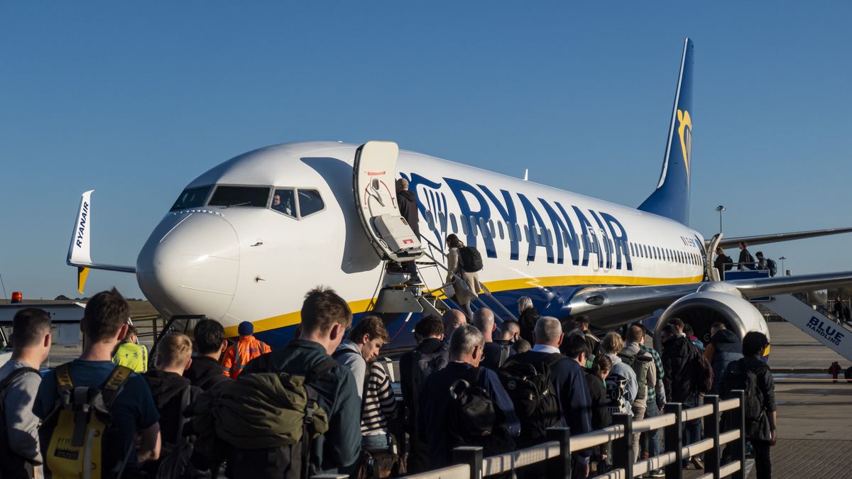 Passengers waiting in line and boarding a Ryanair low cost airline airplane at London Stansted Airport in the UK. The Boeing 737-800 passenger aircraft of the budget carrier has the registration tail number EI-ENF. Ryanair is an Irish Ultra Low-cost carrier group with headquarters in Dublin, Ireland with a fleet of 607 planes. Stansted Airport is the tertiary international airport serving London, the capital of England and the United Kingdom, fourth busiest in the UK owned by Manchester Airports Group. Stansted, United Kingdom on October 11, 2024 (Photo by Nicolas Economou/NurPhoto via Getty Images)